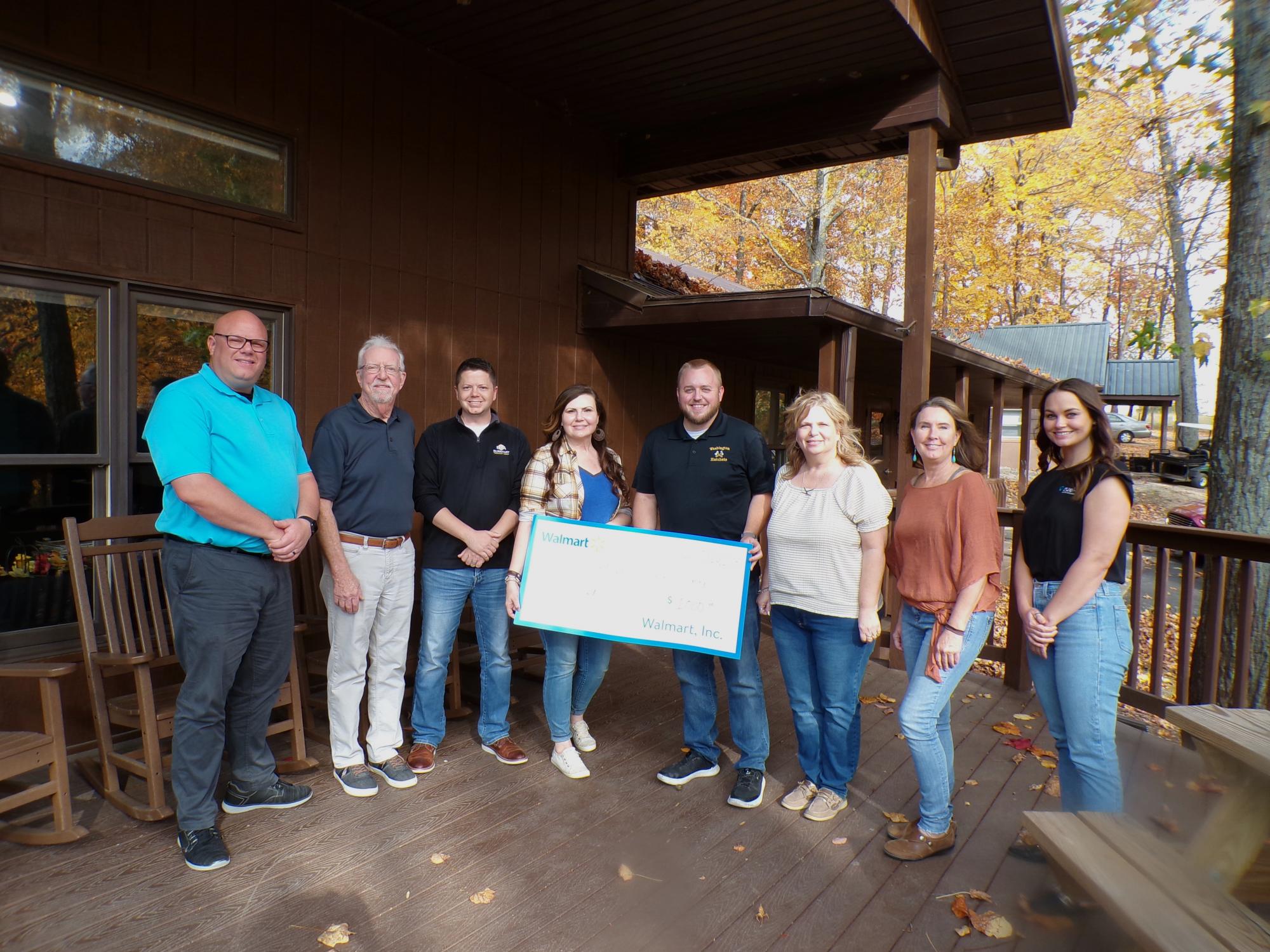 Photo features: Steve Sturgis, board member; Steve Sacksteder, board member; AJ Miles, board member; Zella Taylor, CEO/ED UWDC; Chris Dunahee, board member and Walmart manger; Kori Johnson, Executive Assistant; Carole Smith, board member; Olivia Sherman, board prospect 